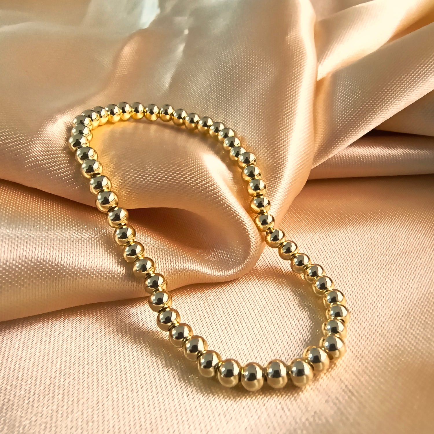 Pulsera Esferas Elasticada - Baño de Oro 18Kt
