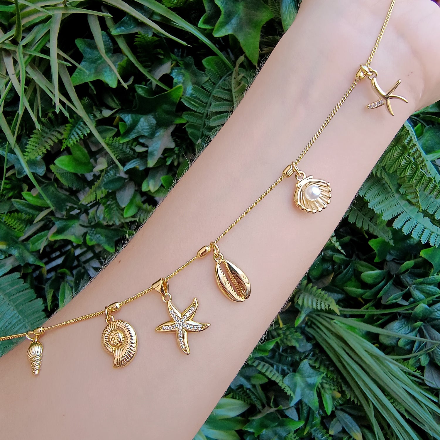 Conjunto Ariel Cadena + 7 Charms - Baño de Oro 18Kt